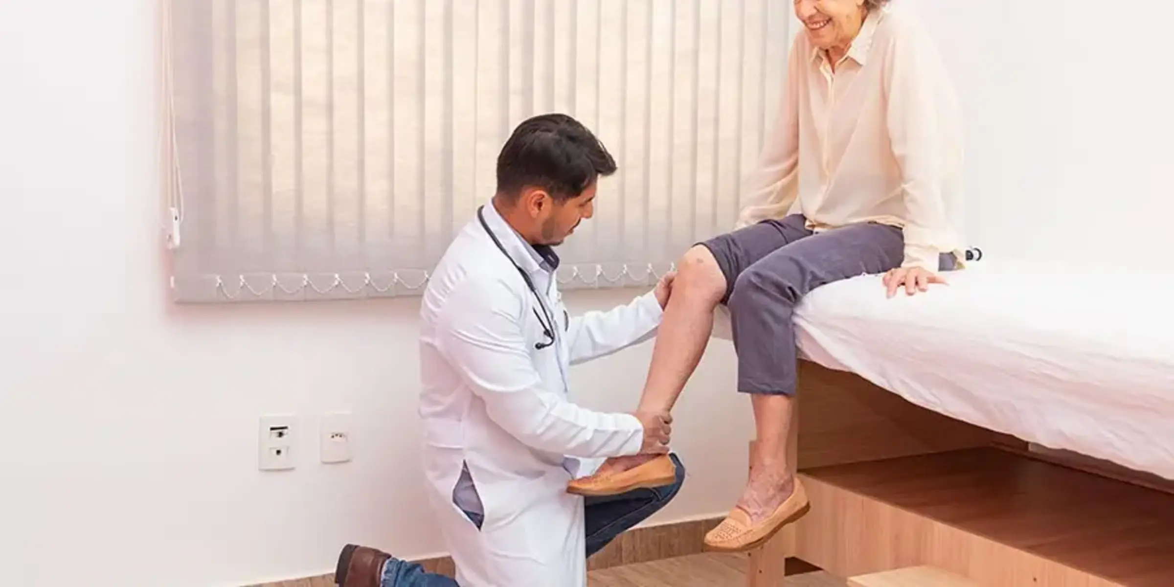 doctor-examining-female-patient-knee-joint-replacement
