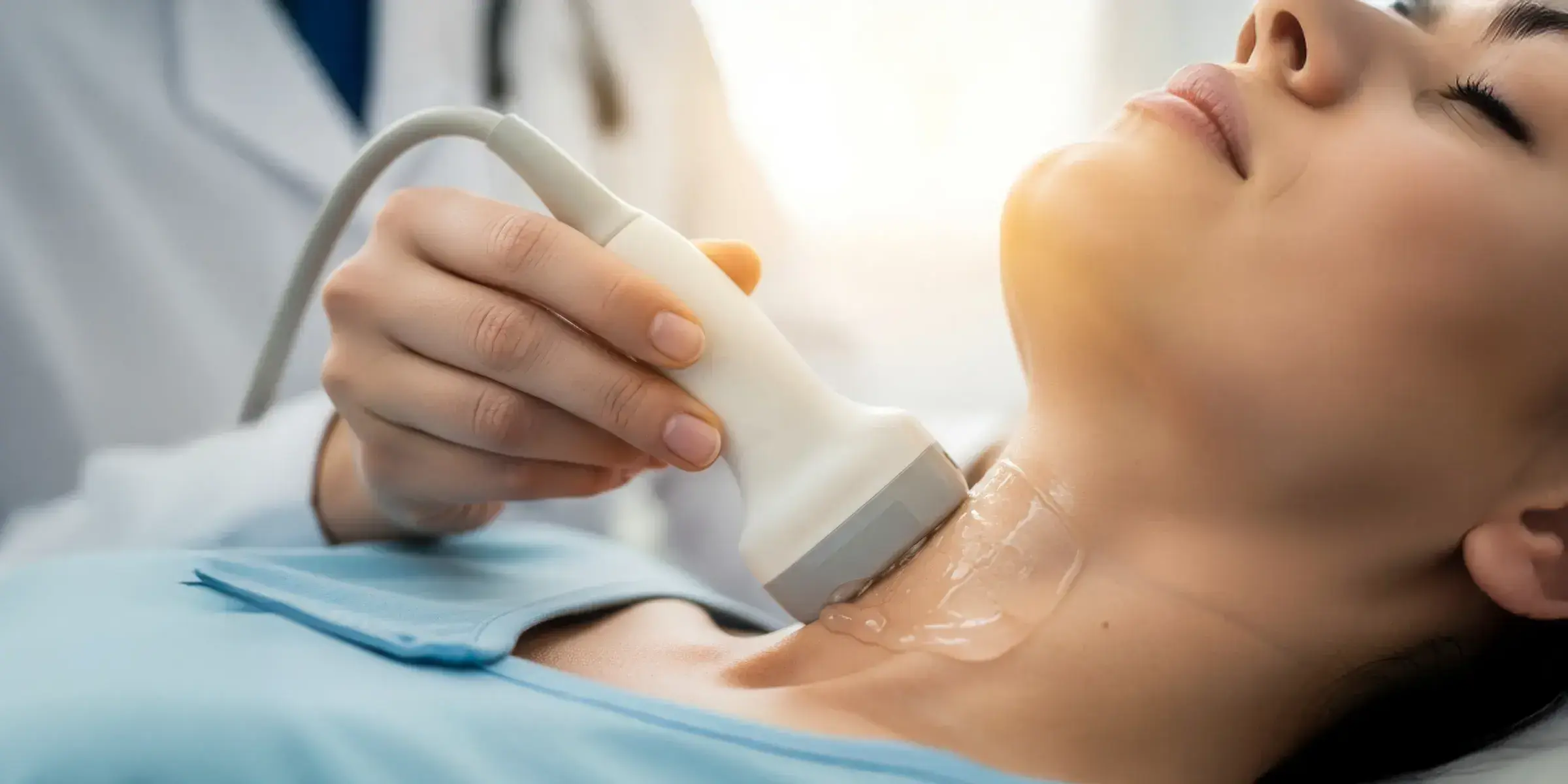 woman getting ultrasound on neck