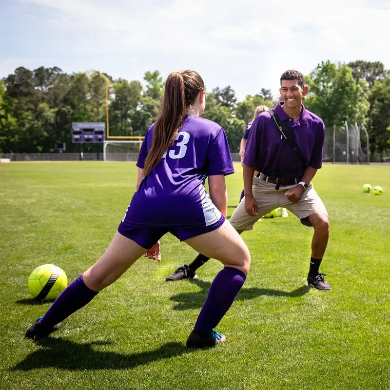 soccer player with athletic trainer