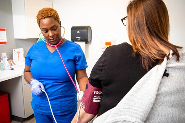 nurse-checking-patient-blood-pressure
