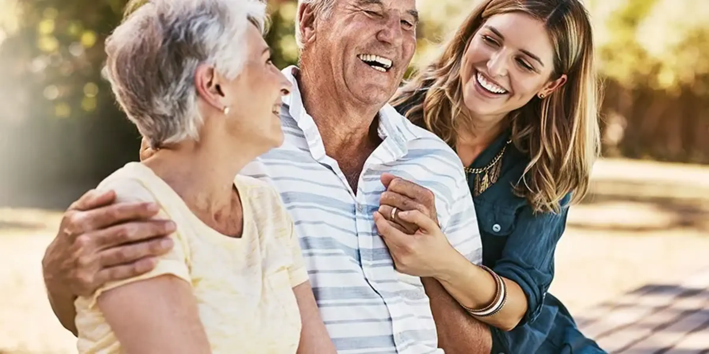 woman and grandparents hugging