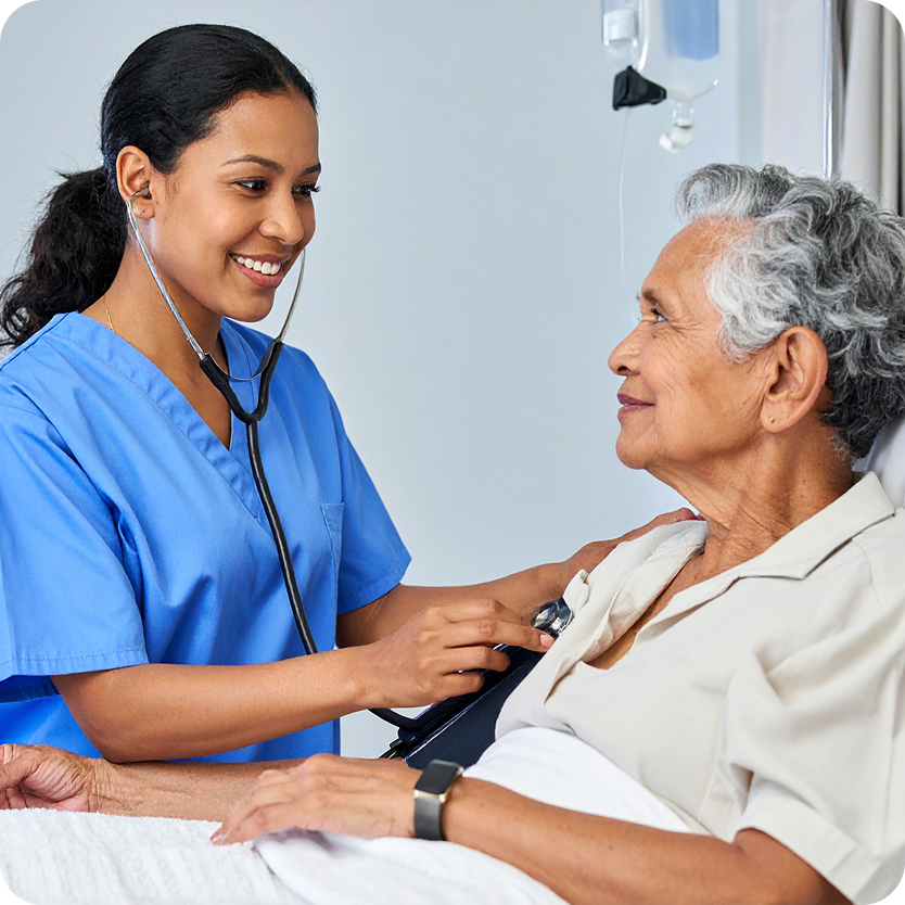 Woman and nurse hospital bed stethoscope