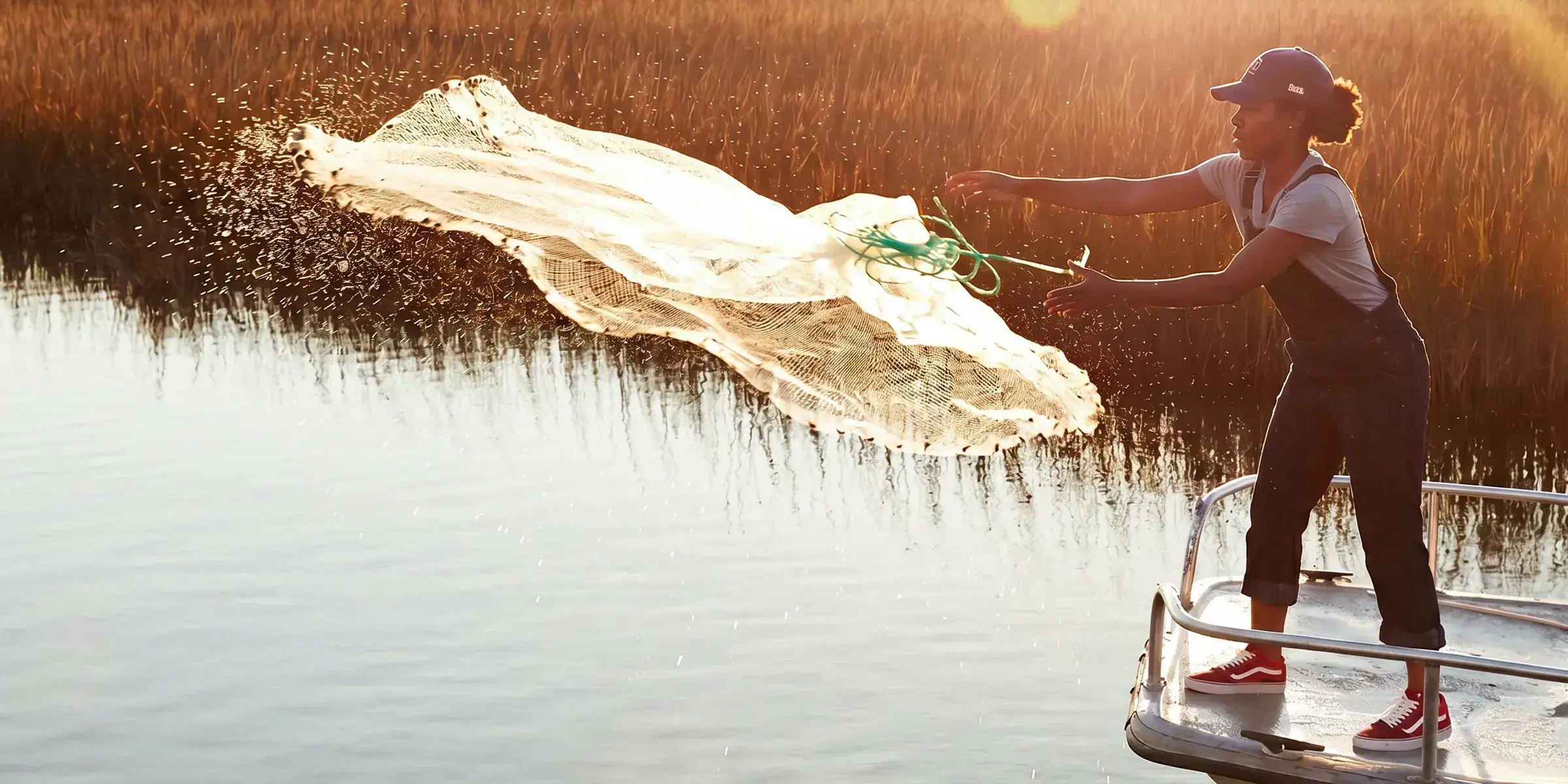woman casts fishing net