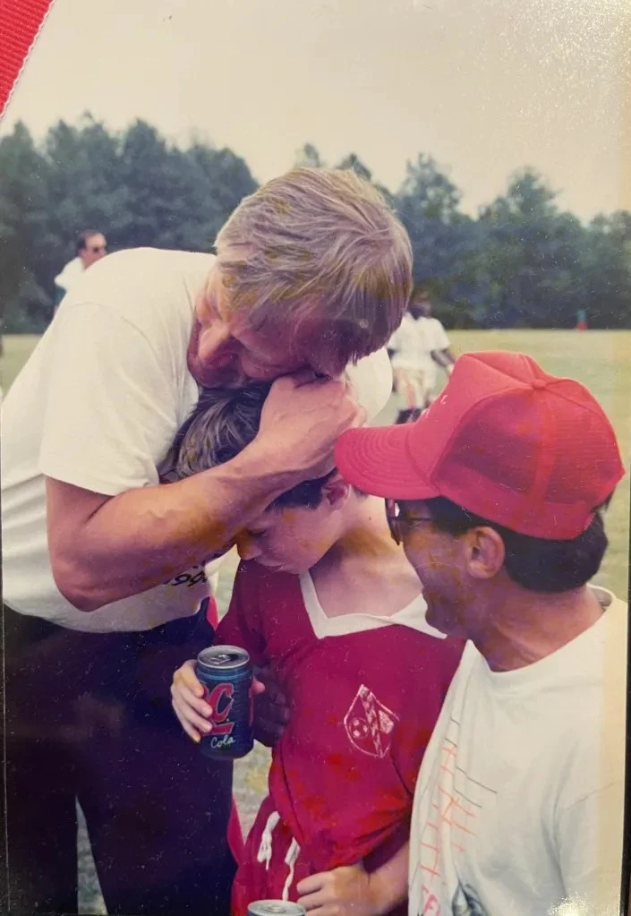 Czarniecki embraces young Dr. Stuart after a game