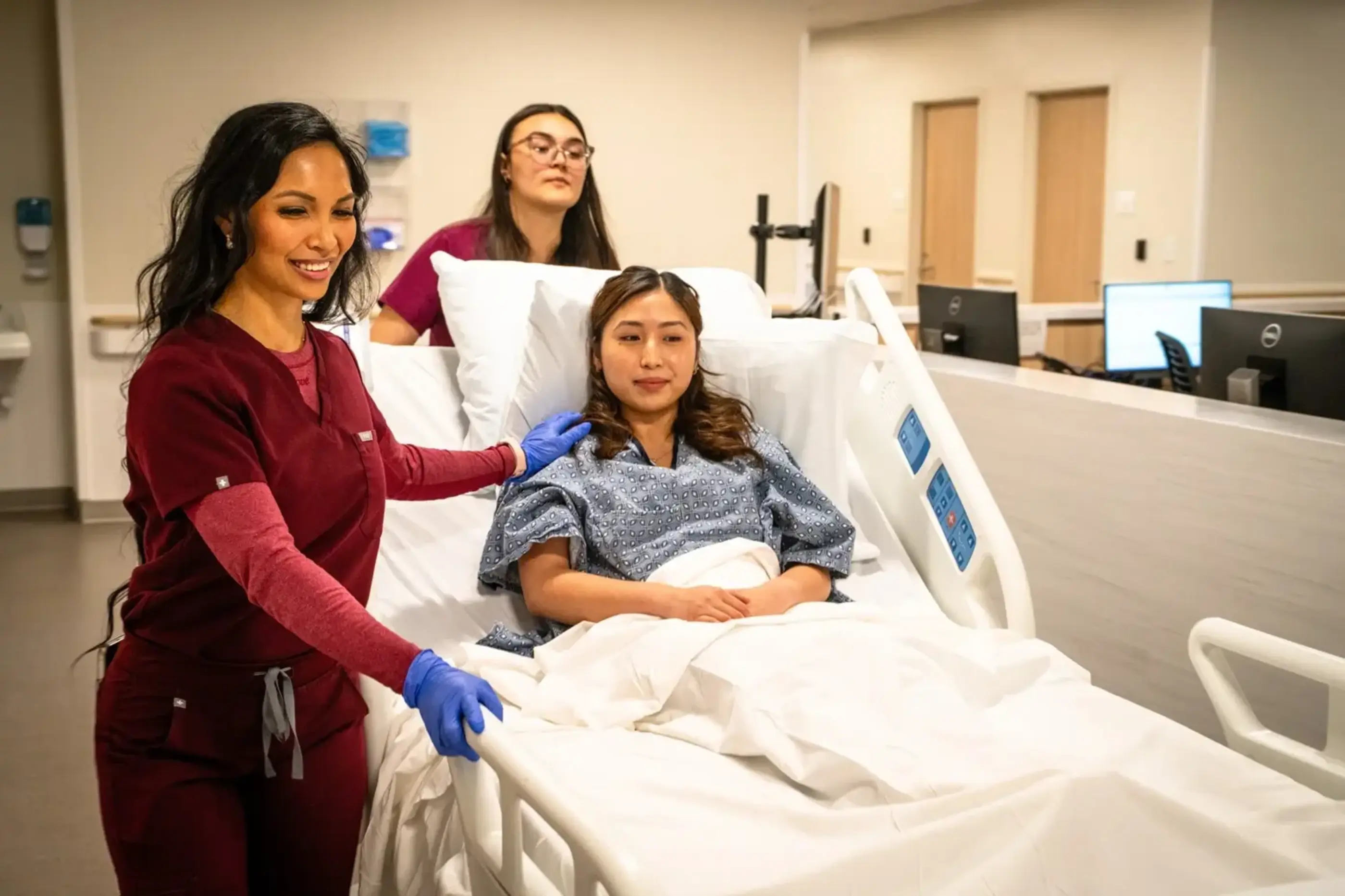 Nurses wheel patient to surgery