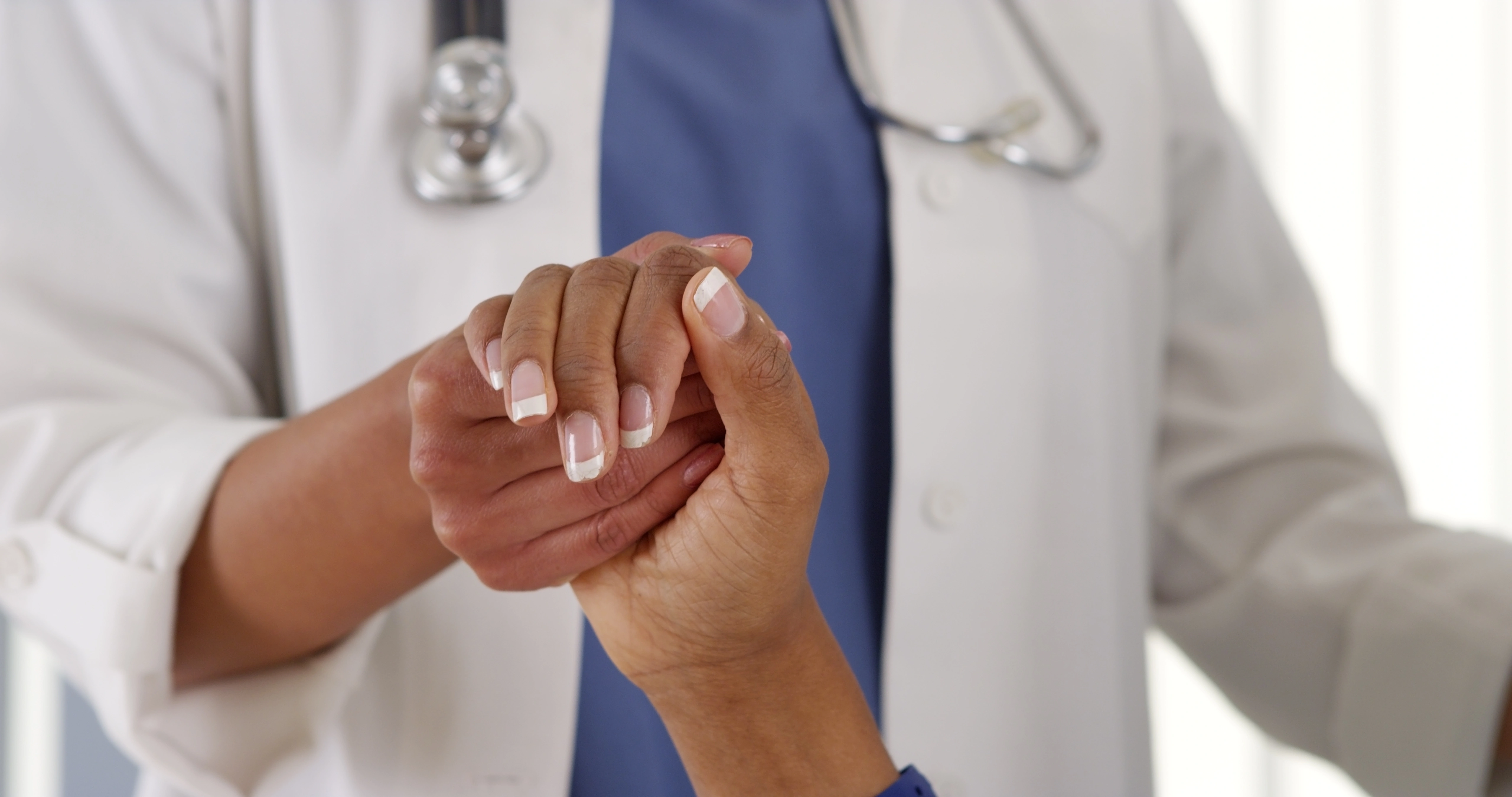 Doctor and patient caring hand