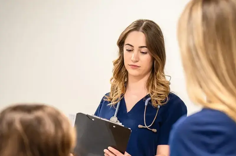 nurse checking patient chart