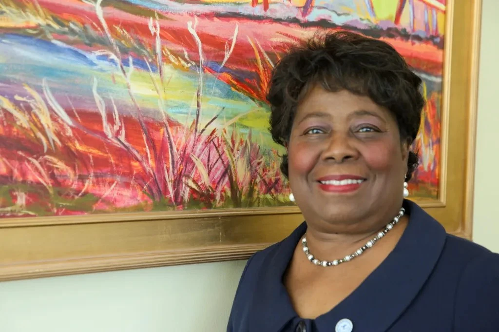 Roberta Huger-Pinckney posing in front of wall painting