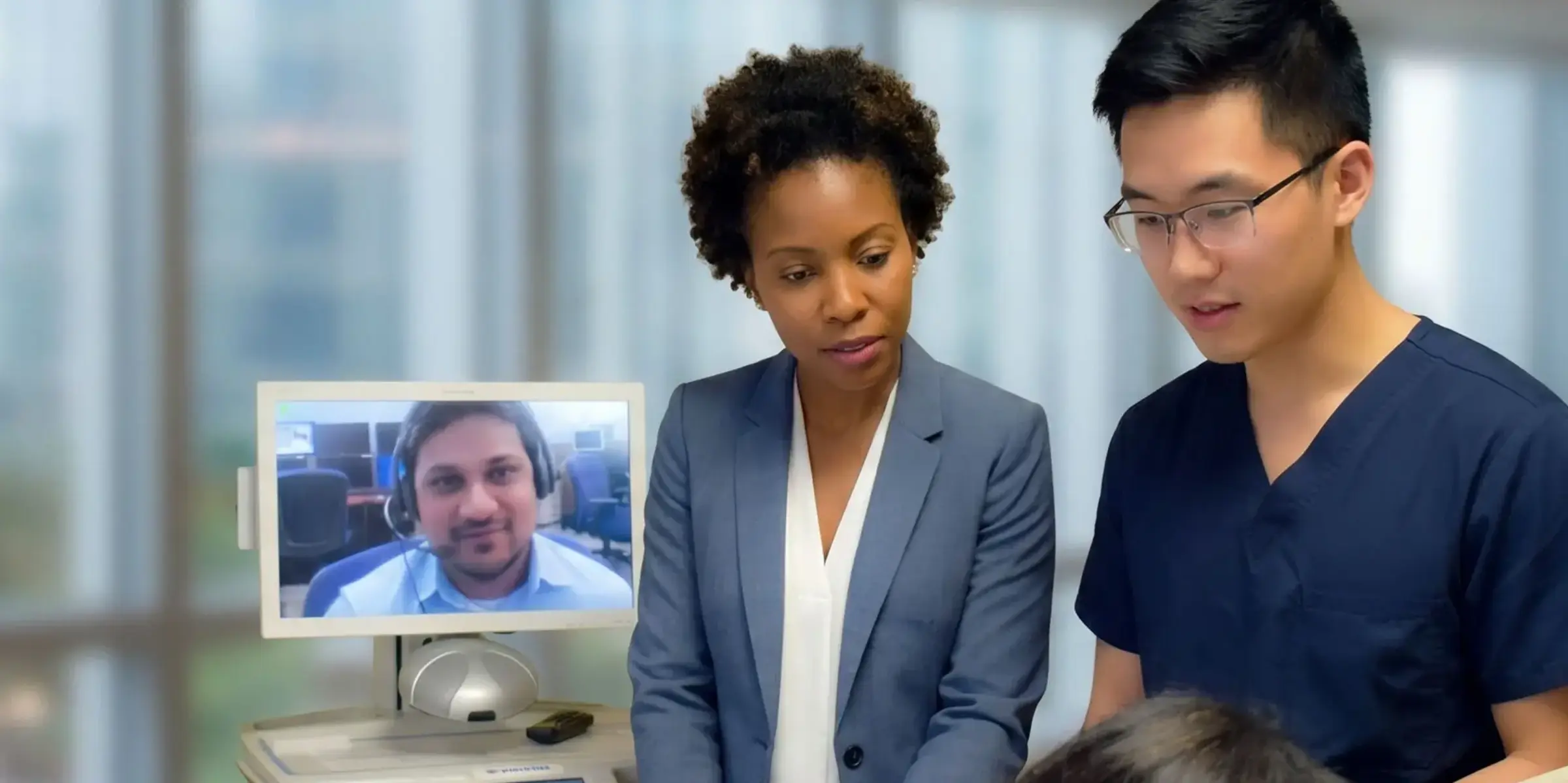 Translator on video call with doc and patient