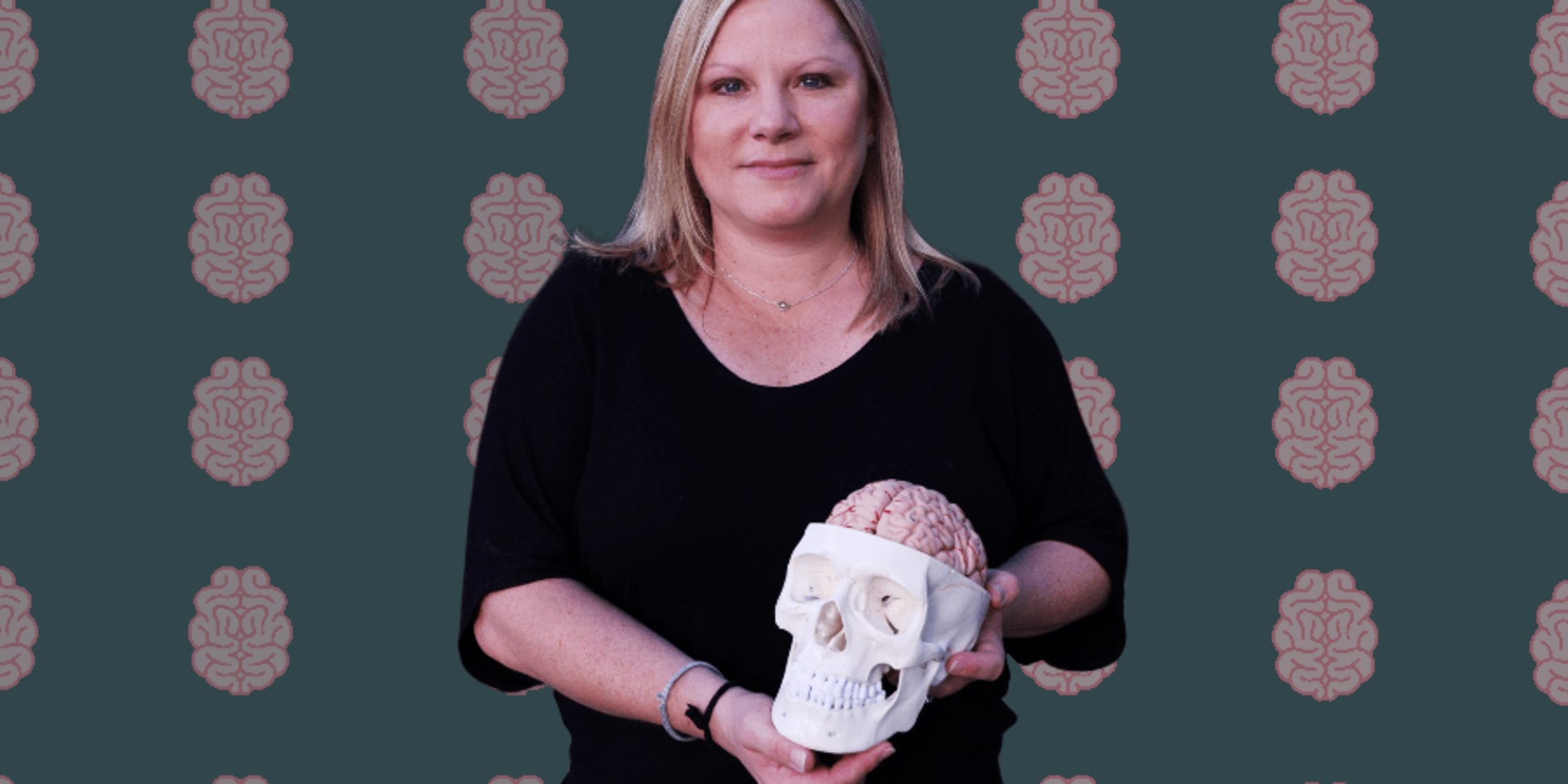 Jessica Trego holding a skeleton head for brain injury