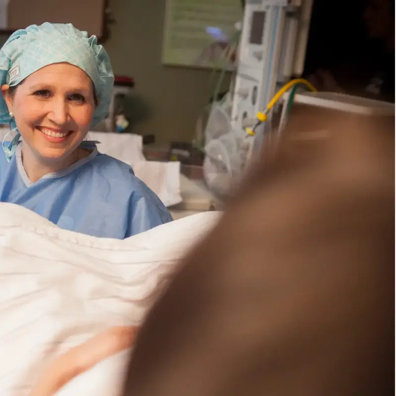 Doctor helps mom in labor
