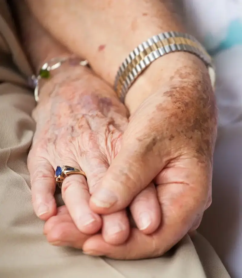Older couple hold hands ?? ''