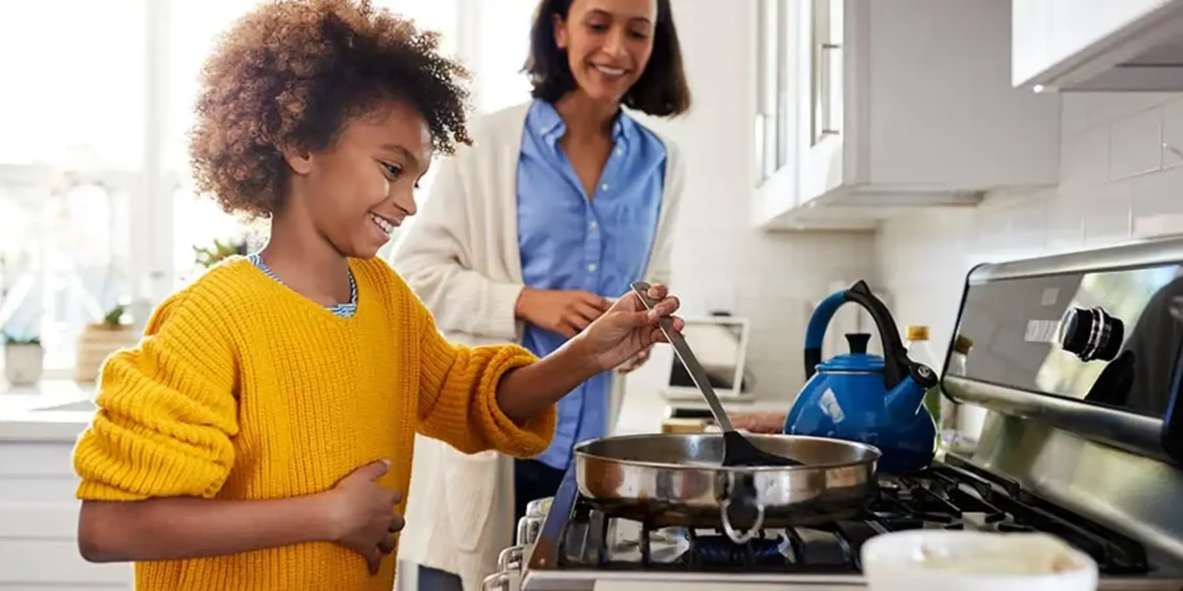 mom and daughter cooking together