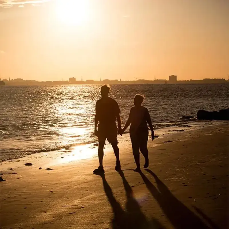 Couple walking at sunset