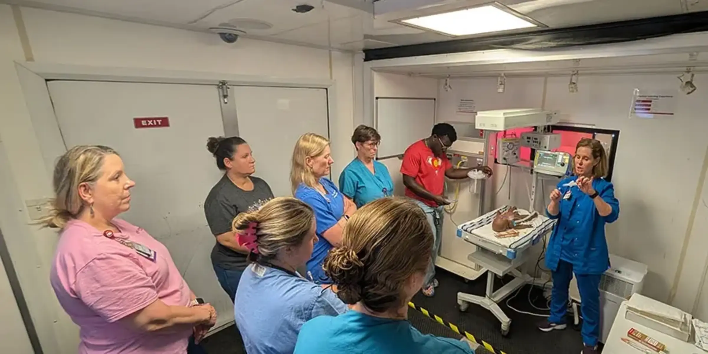 Instructor speaking to nurses Simulator training