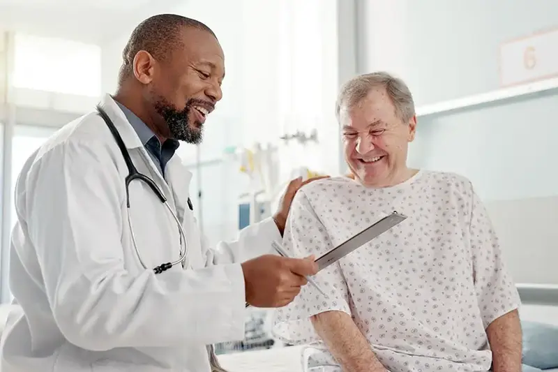 patient with doctor discussing colonoscopy procedure