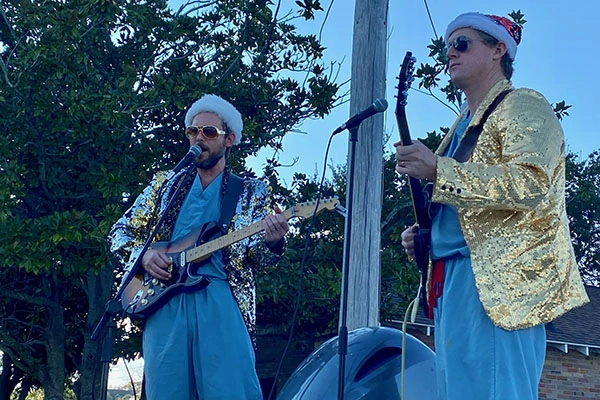 doctor lamb performing with band member