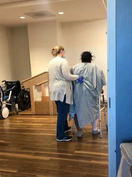 Olga walking with nurse