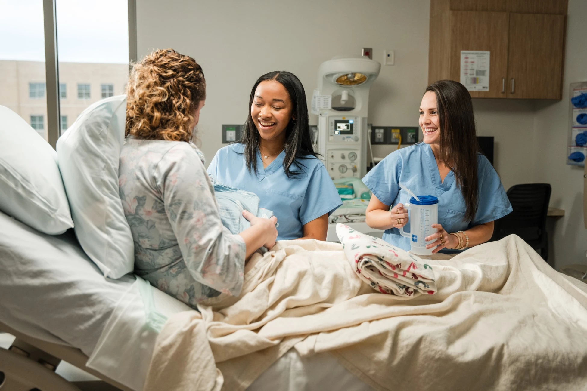 New mom in hospital with nurses
