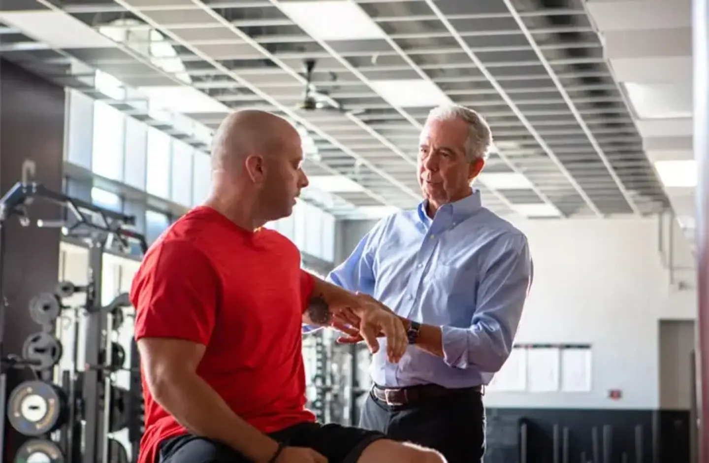 Doctor and patient in gym