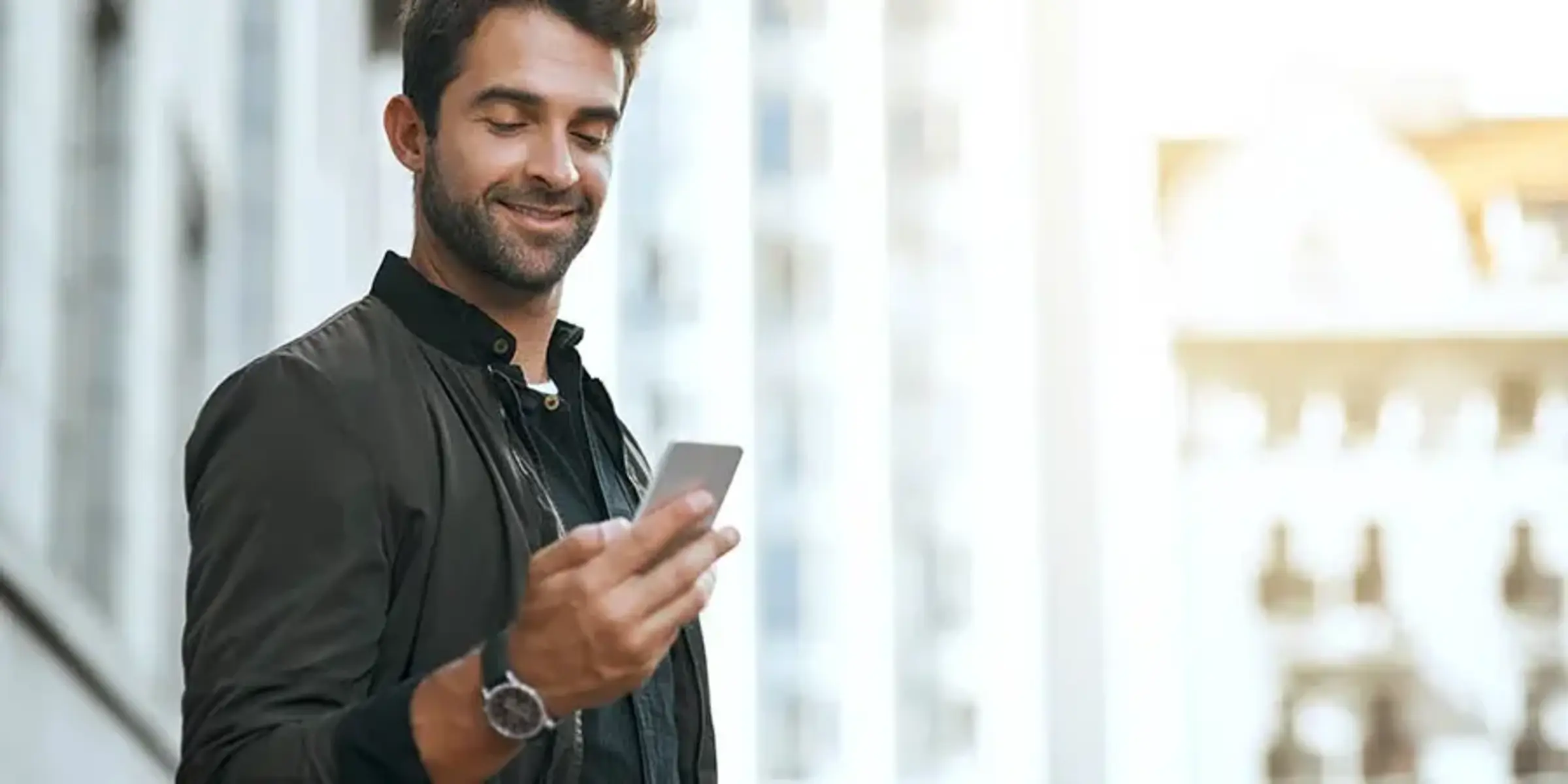 man searching for primary care doctor on his cellphone