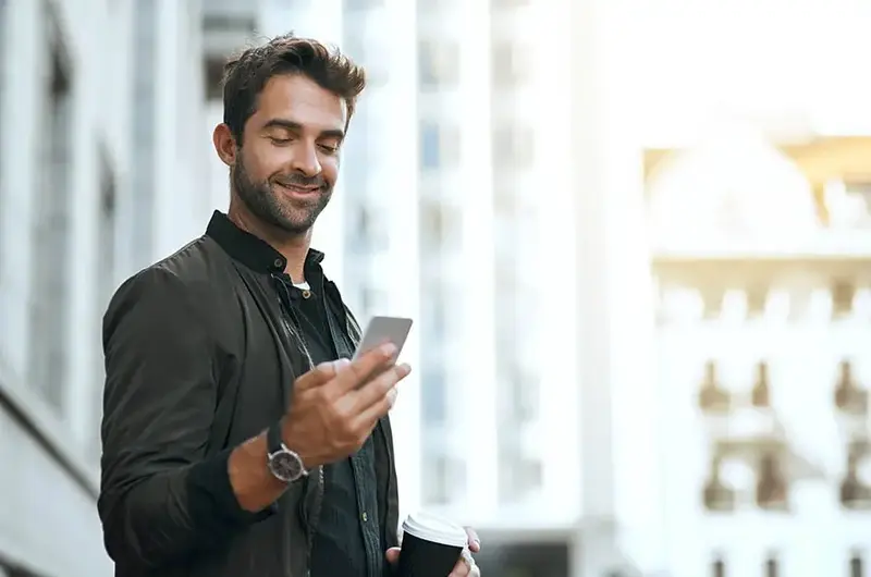 man searching for primary care doctor on his cellphone