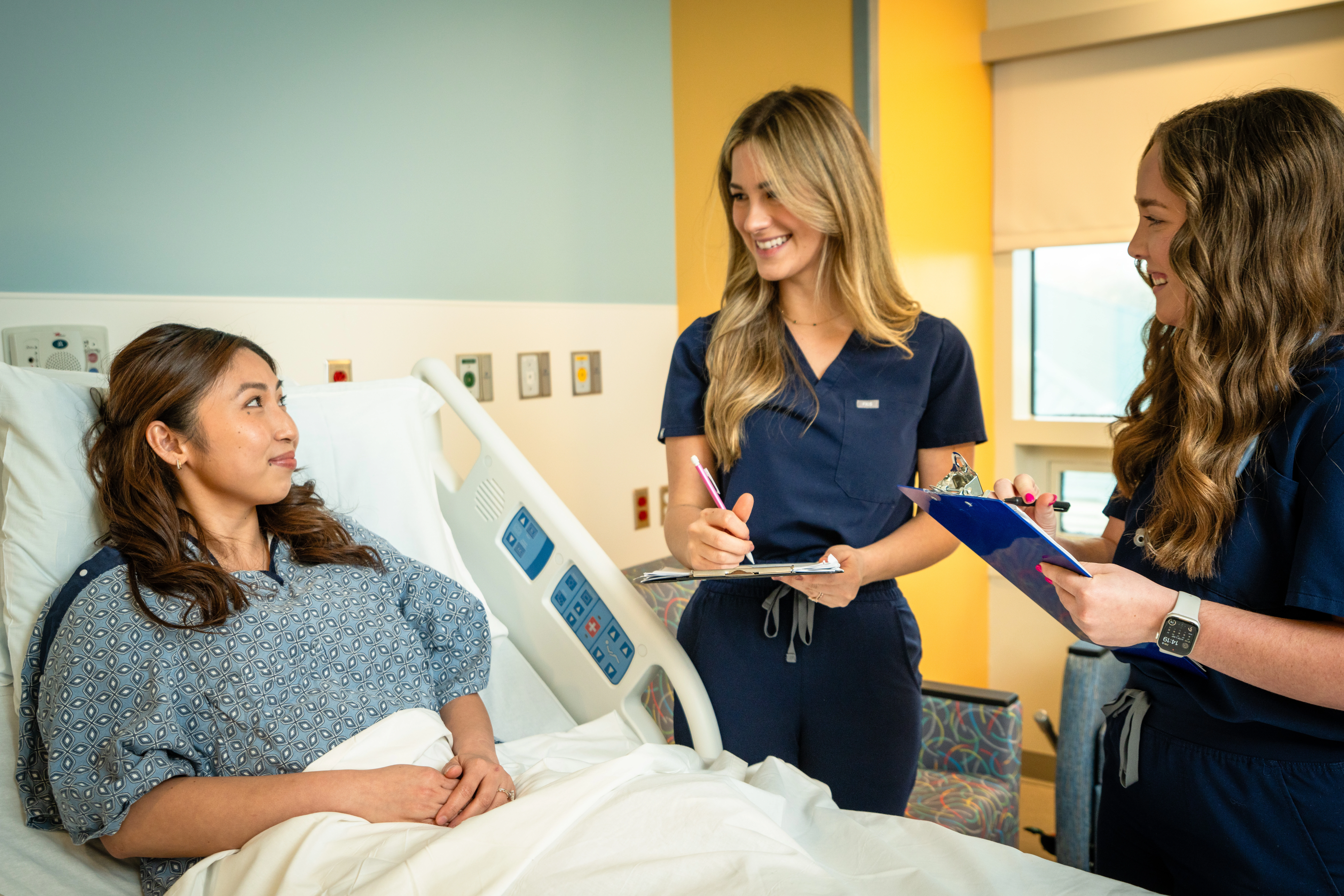 nurses checking on patient - homepage