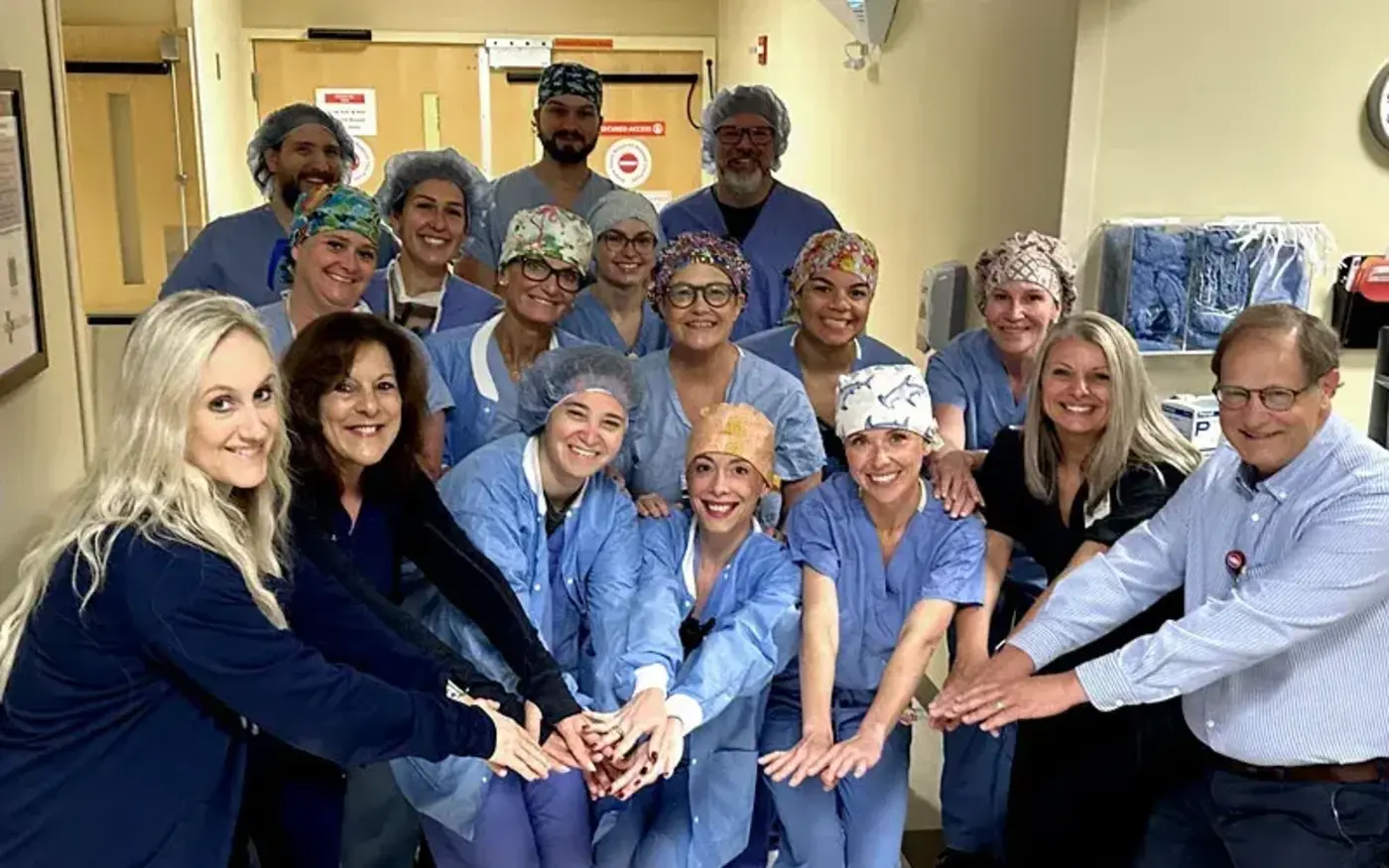 Surgery team hands in