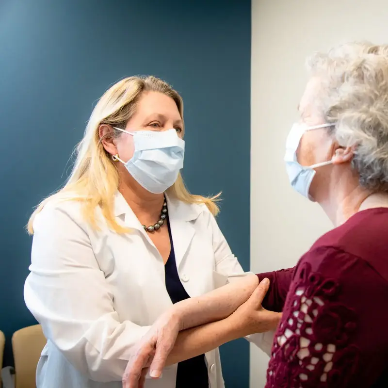 woman with mask getting checked