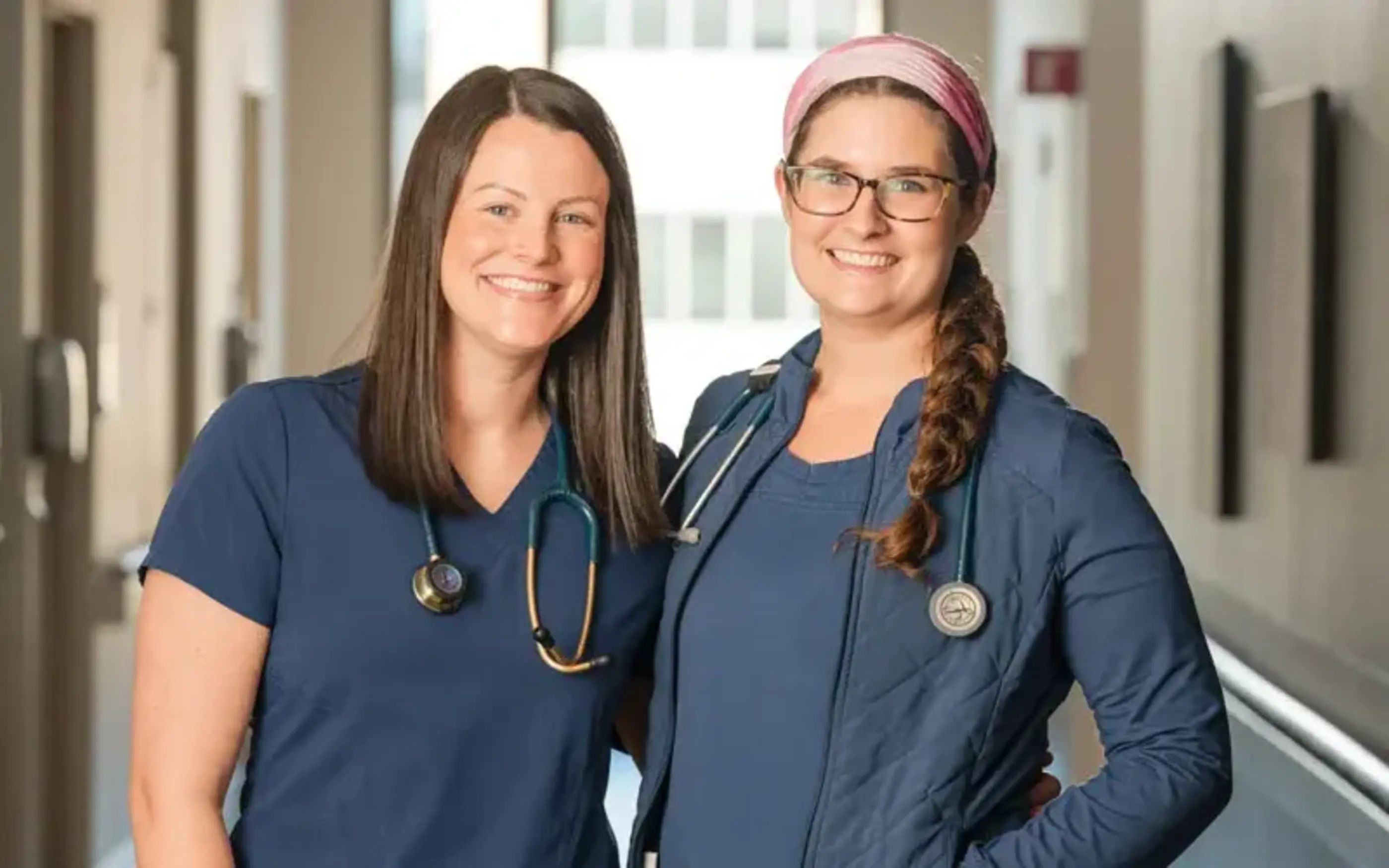 Nurses smile in hall
