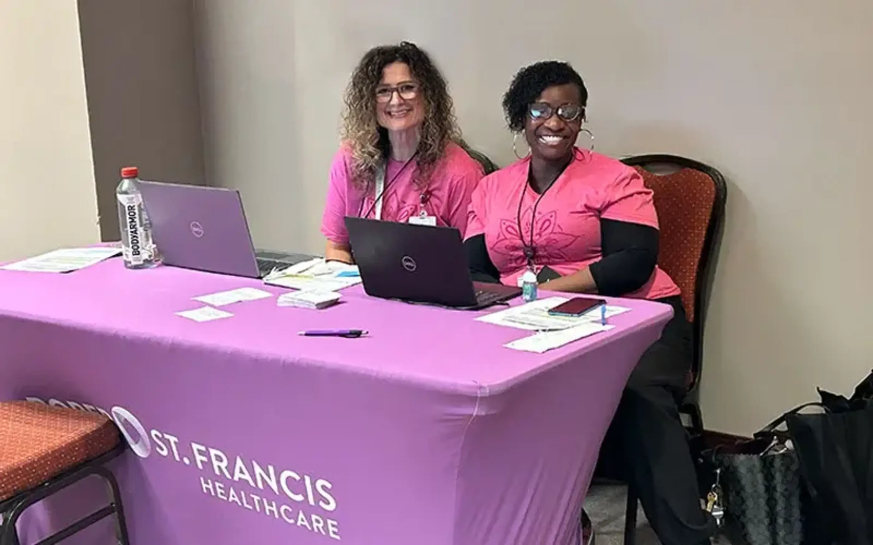 Volunteers at health table