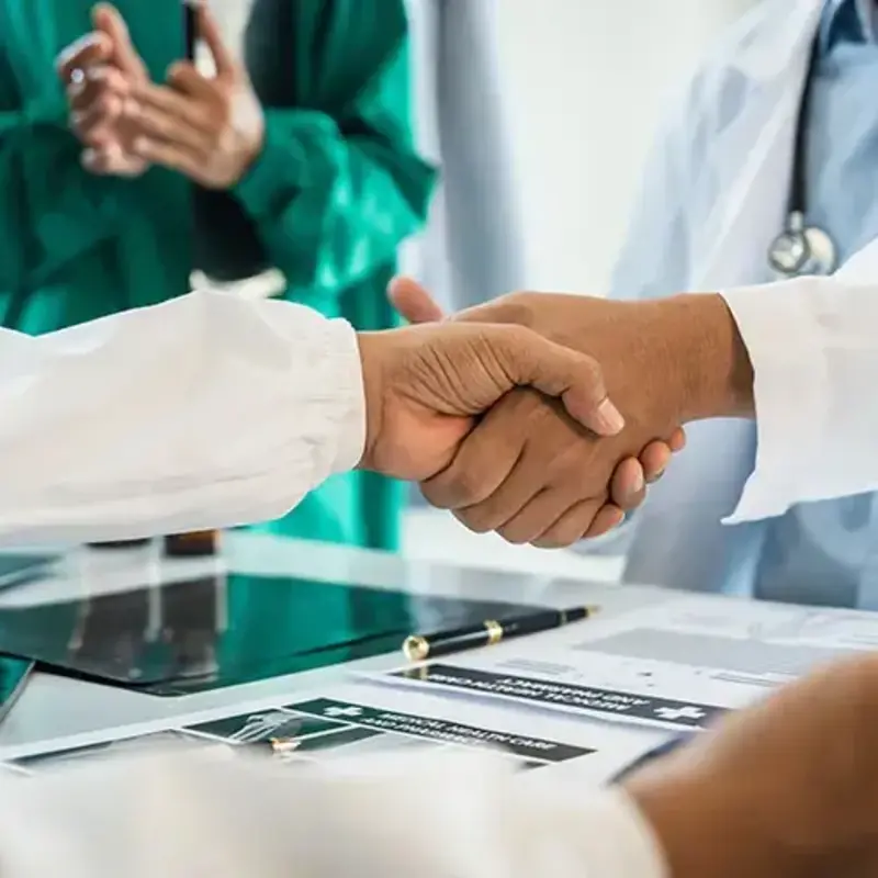 Doctors shake hands