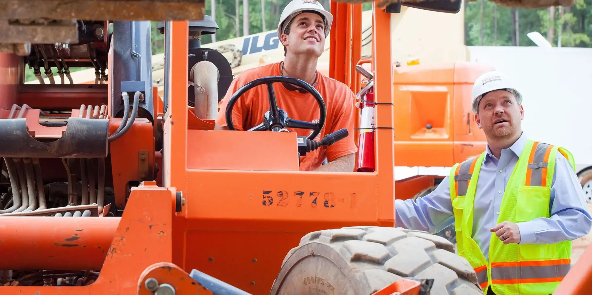 construction workers use machines