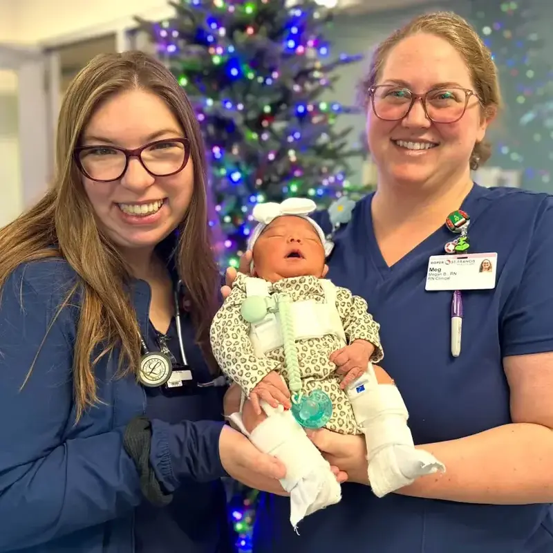Pediatric nurses with baby