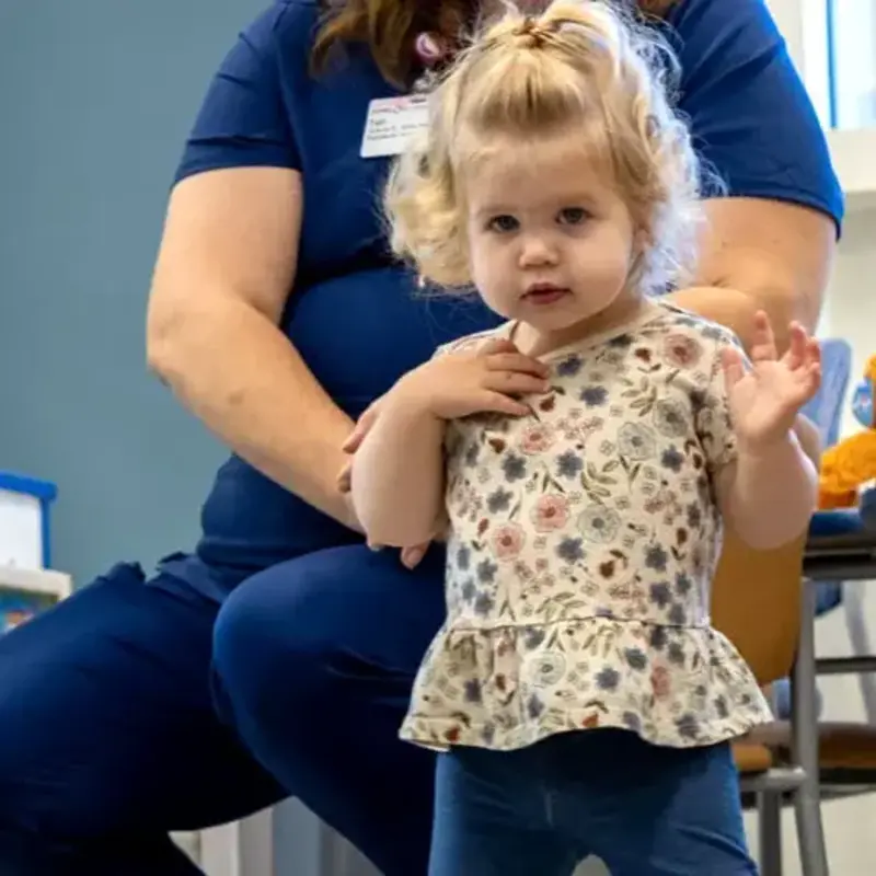 Toddler in children's unit playroom