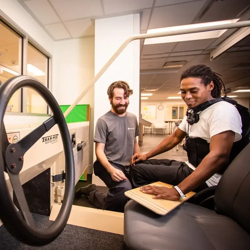 Driving rehab instructor with patient
