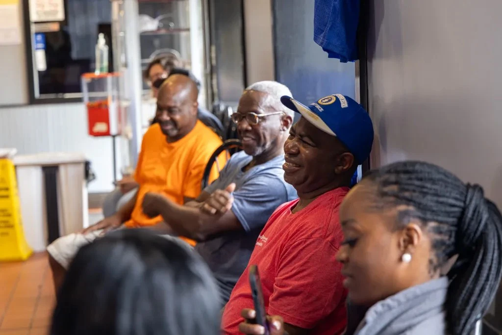 people waiting at barbershop