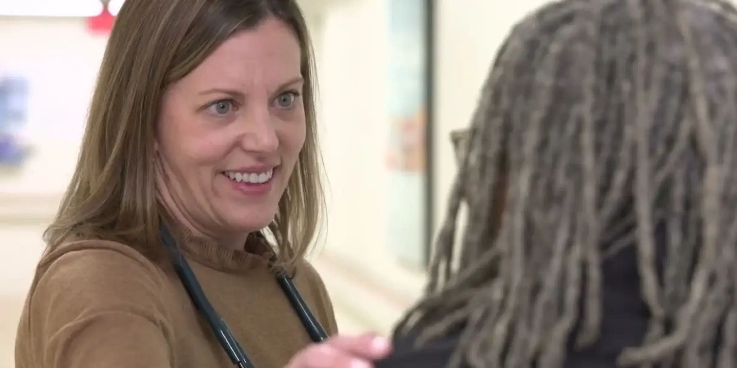 Doctor places hand on patient shoulder