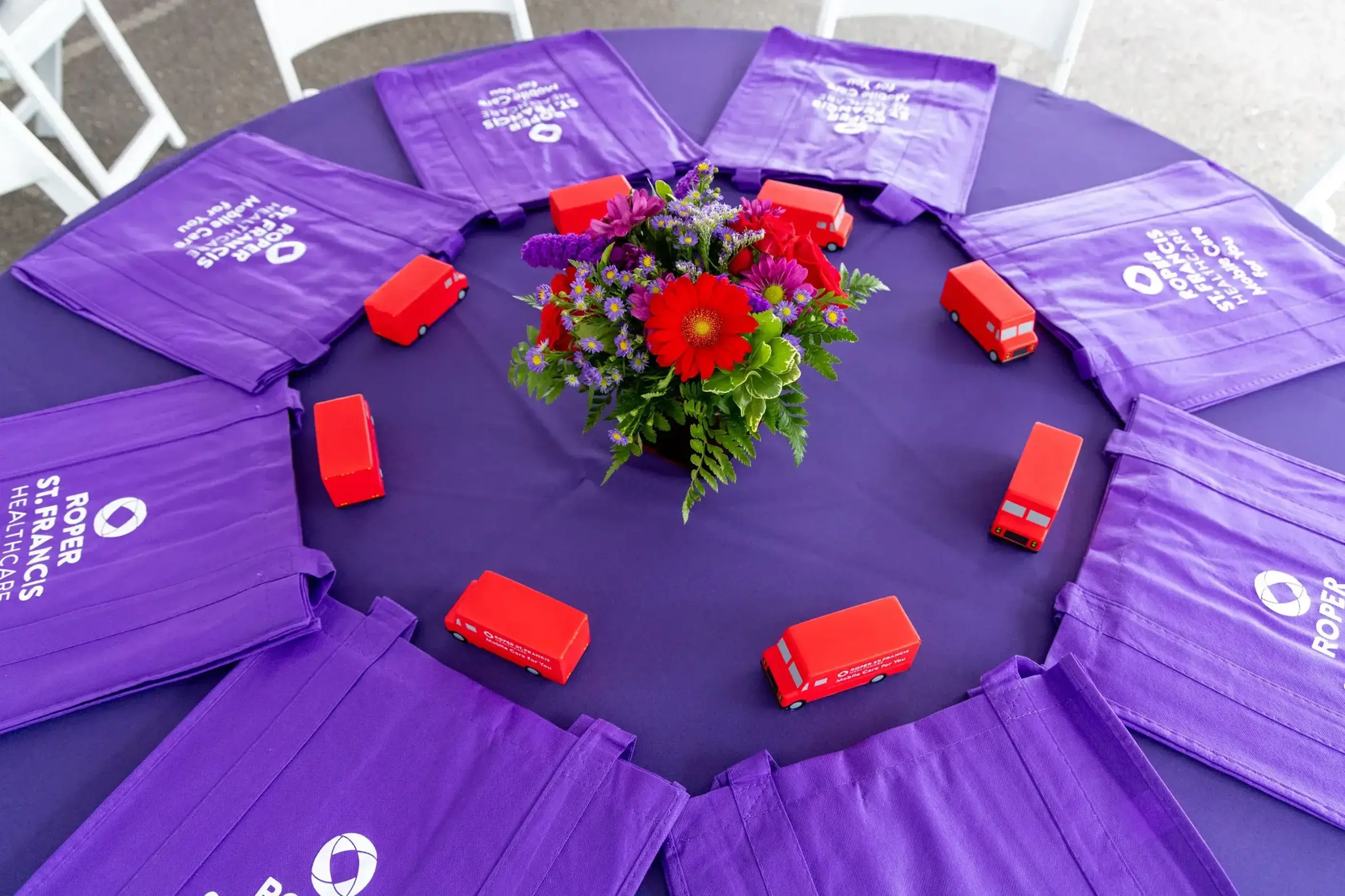 mobile unit ribbon cutting table decor