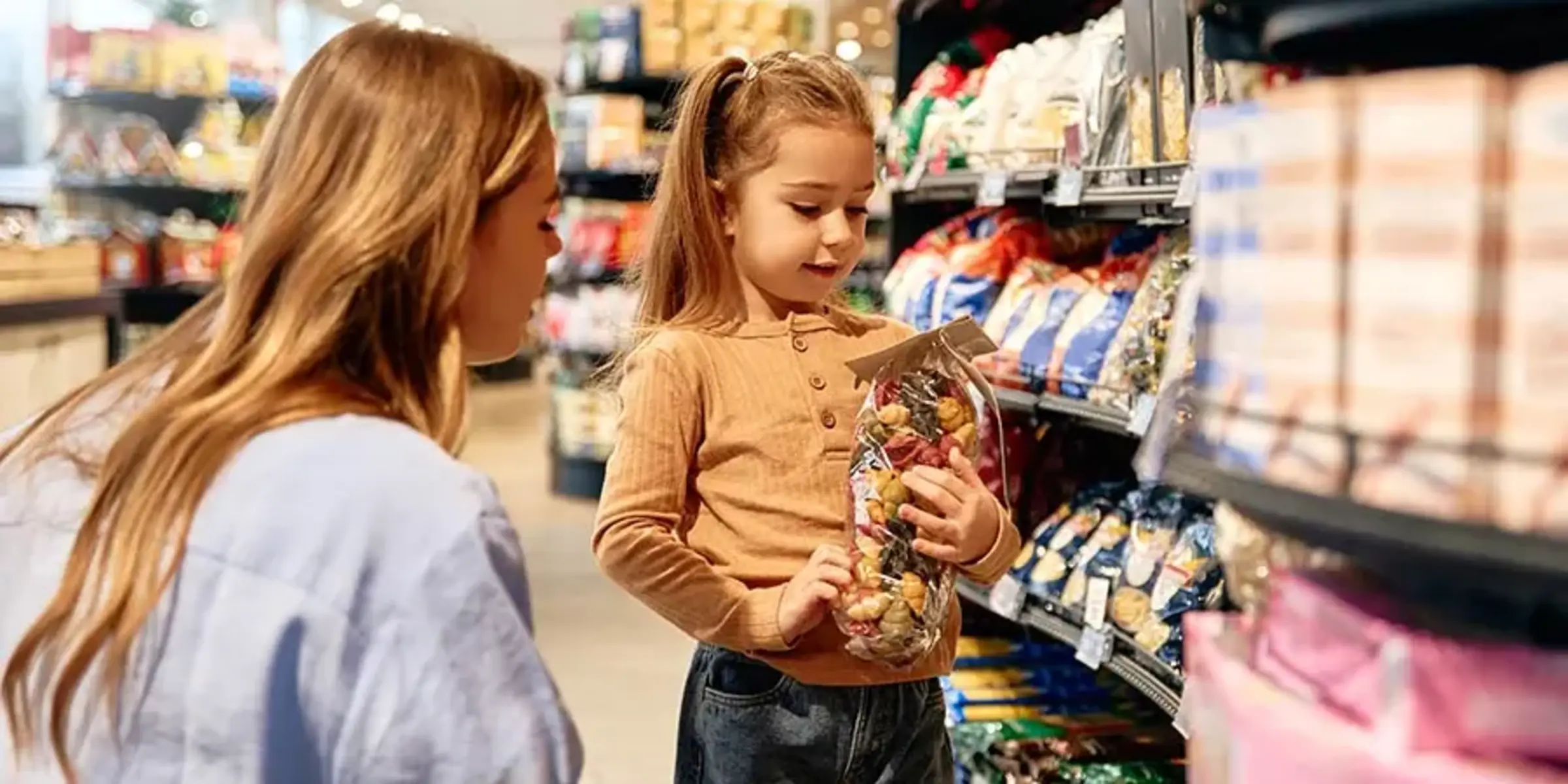 mother and daughter in the pasta aisle