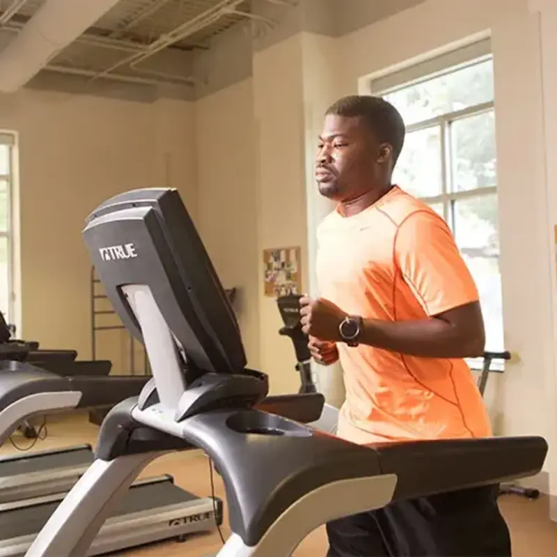 man running on treadmill