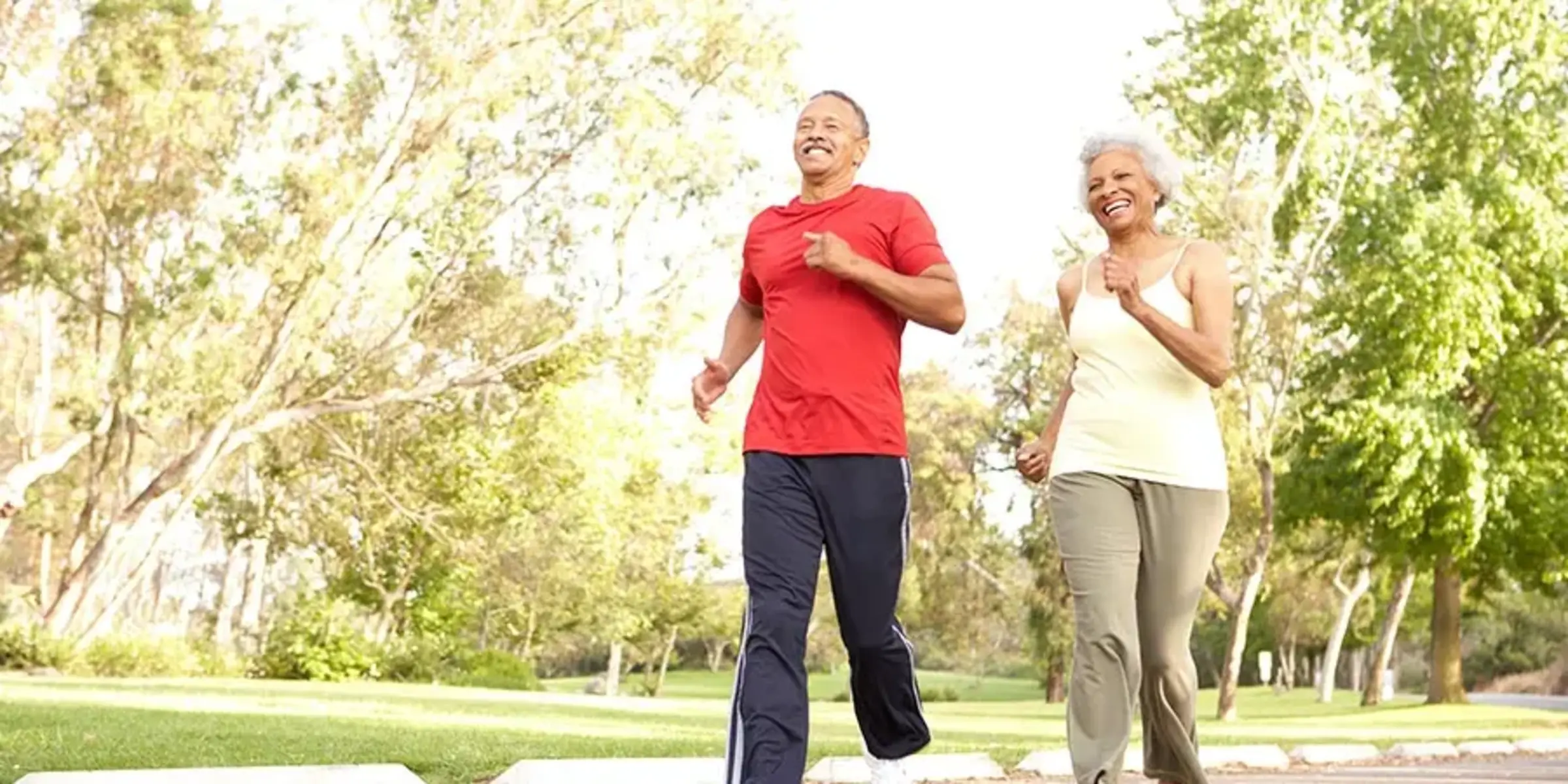 Senior Couple Jogging In Park