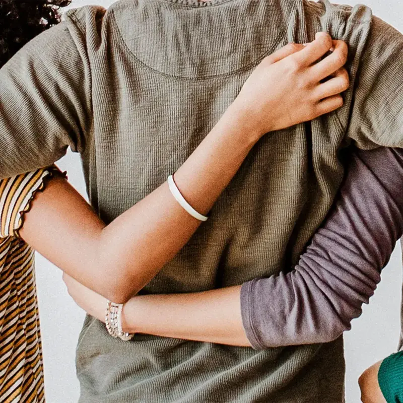 People put arms around eachother