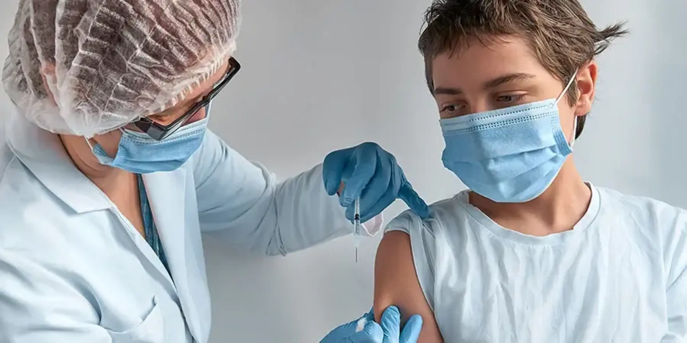 young boy getting vaccine