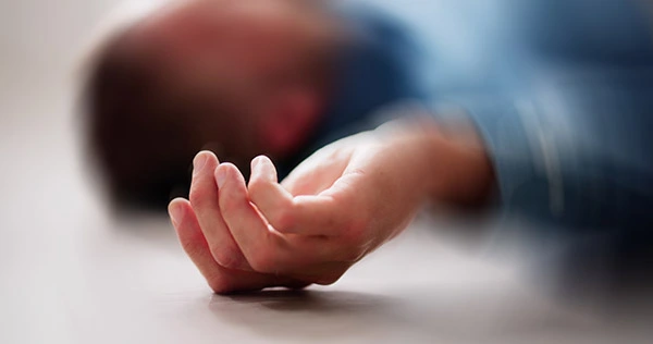 man lying on floor epilepsy seizure