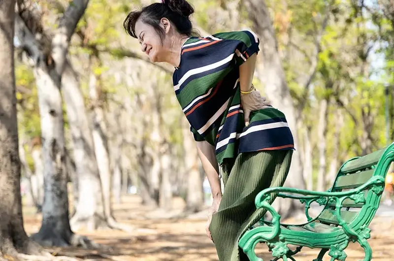 Asian senior woman with hip pain