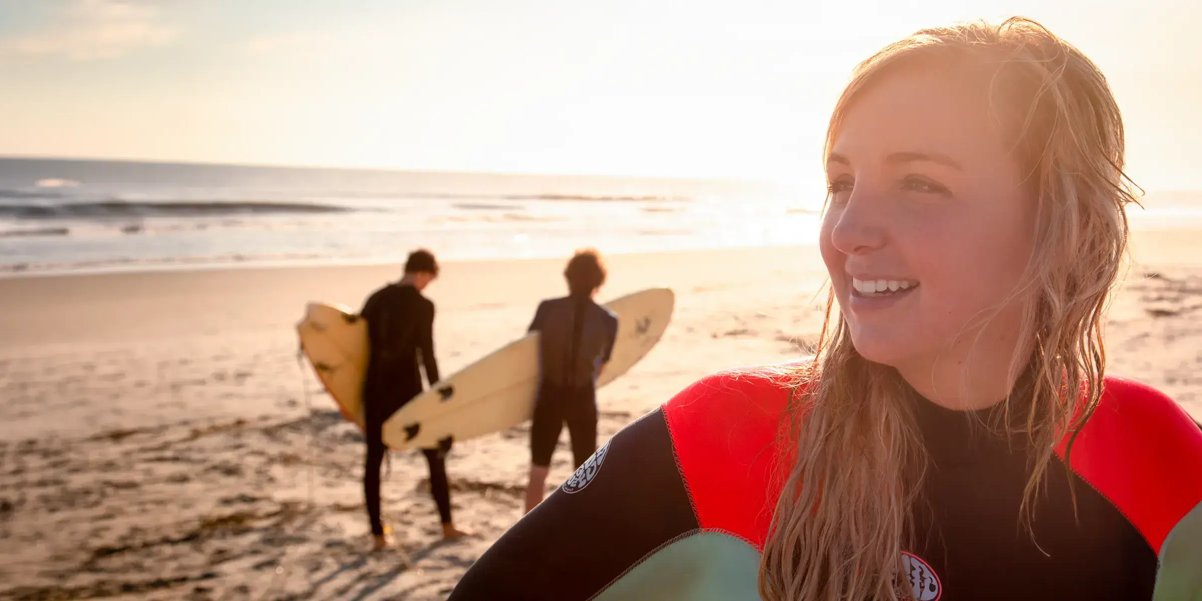woman surfing on beach