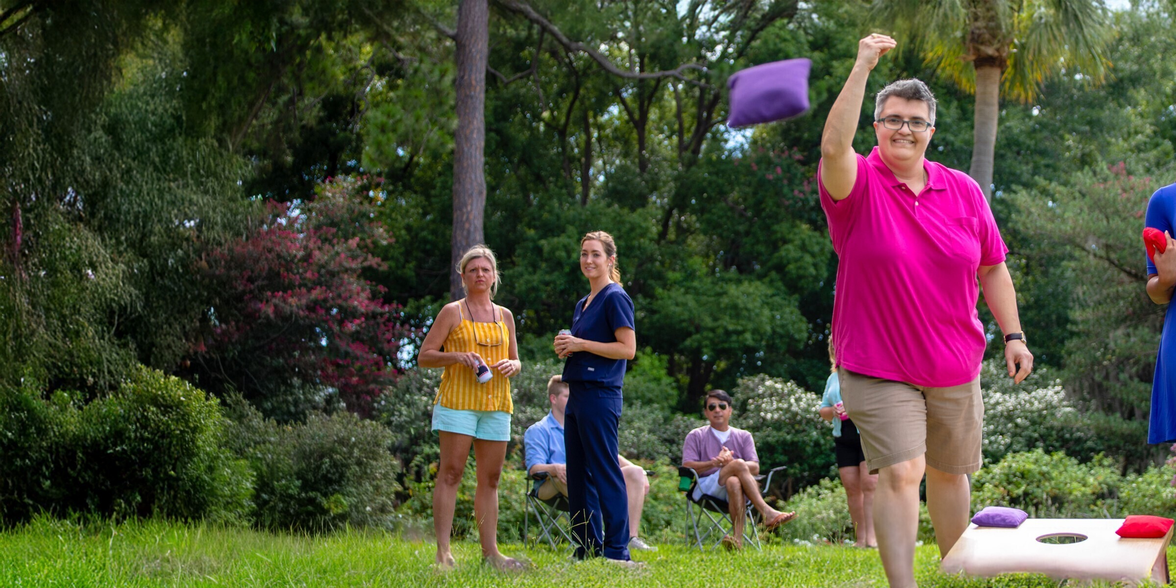 Woman playing cornhole