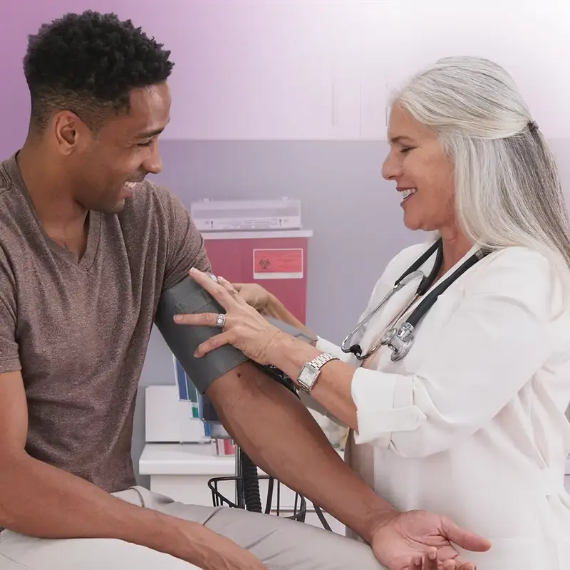 young man with primary care doctor