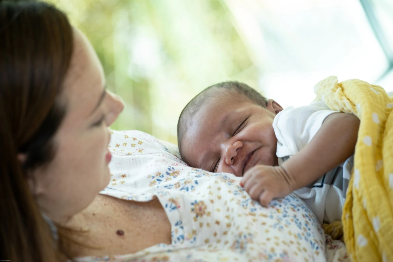 Infant on moms chest